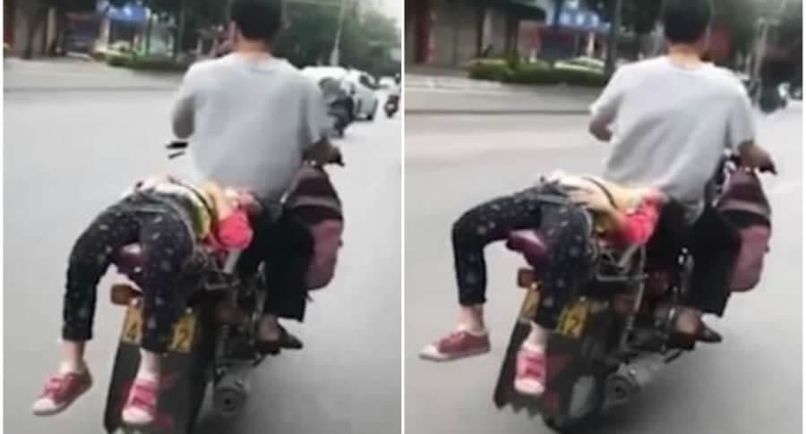 Padre amarra a su hija a una moto para llevarla a la escuela