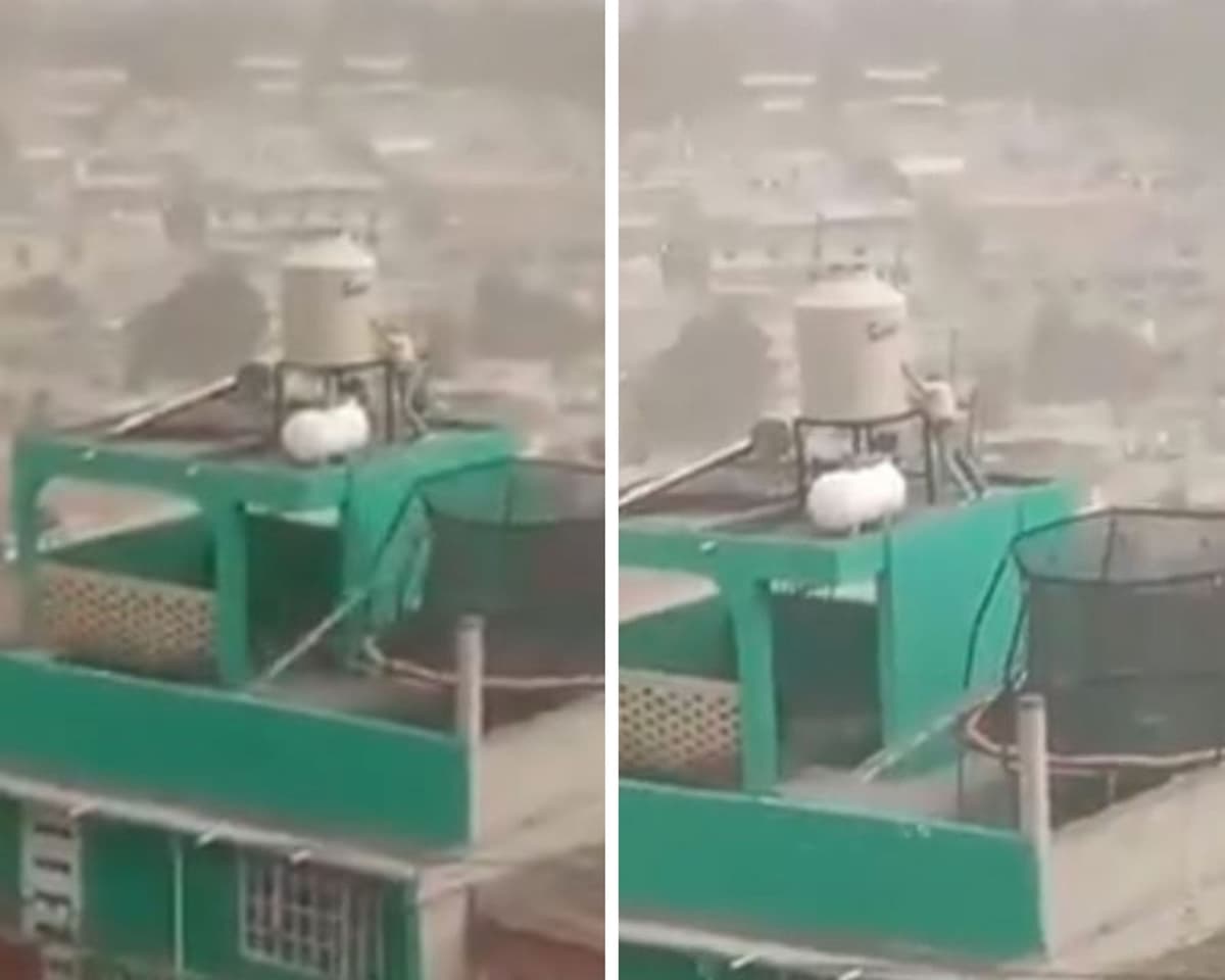 Hombre se aferra a su tinaco en Edomex para que no se lo lleve el viento